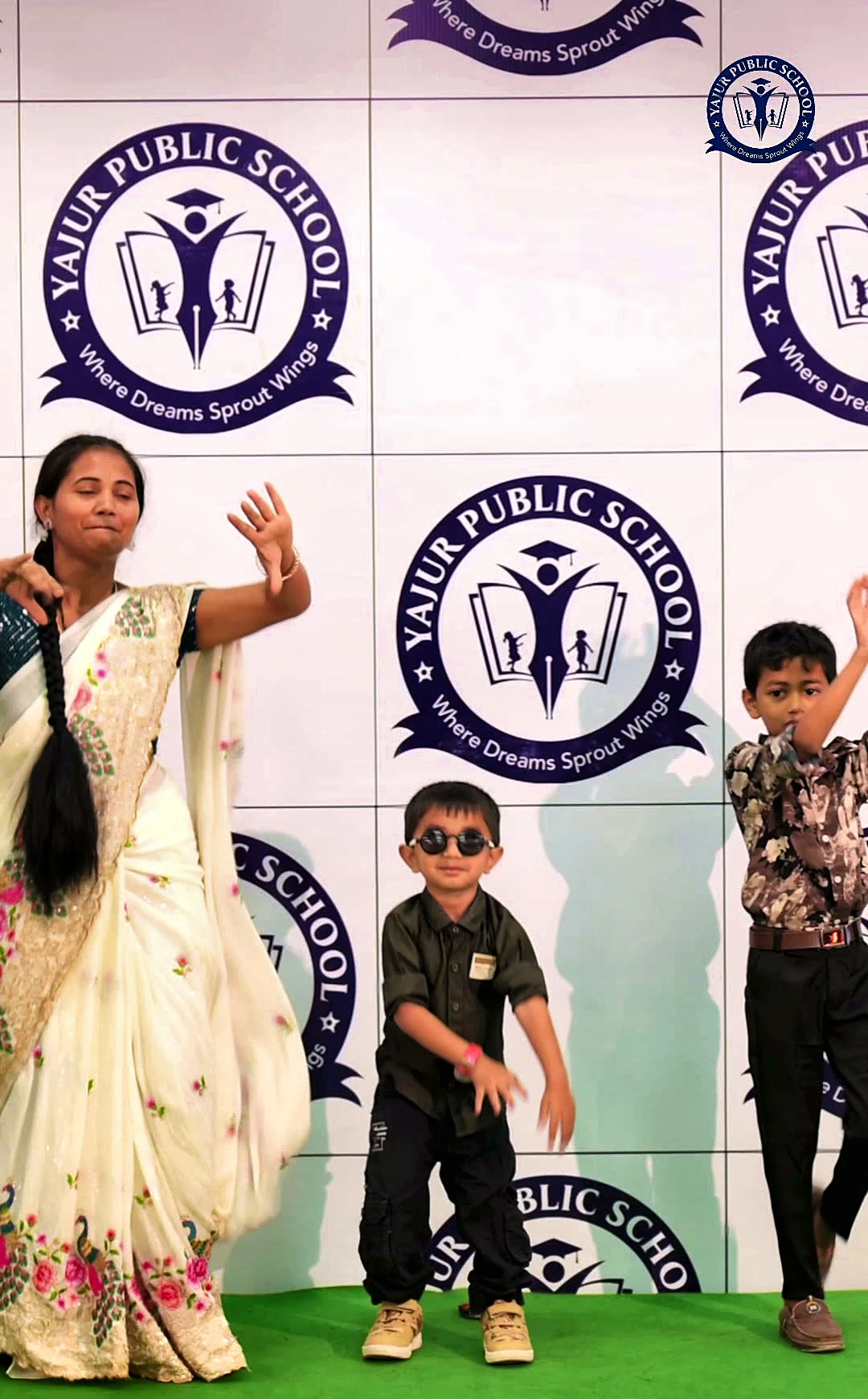A student dancing on stage at the Happiness Carnival