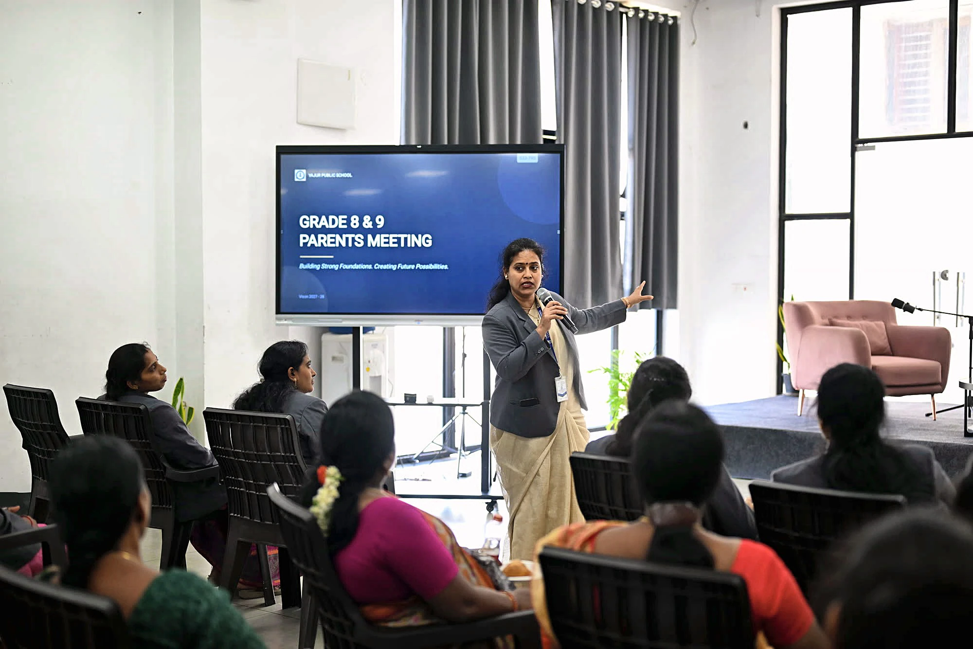 A teacher presenting to parents at Yajur Public School