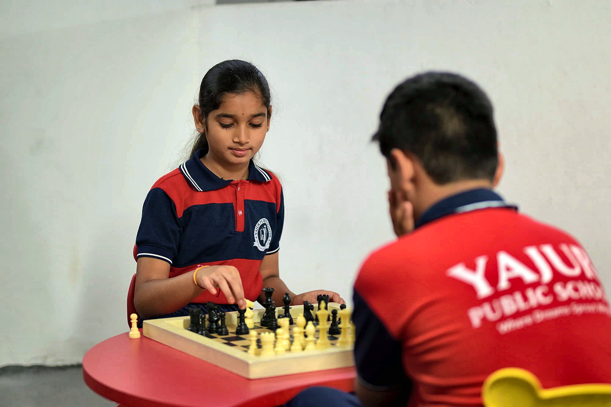 A Yajur student playing chess