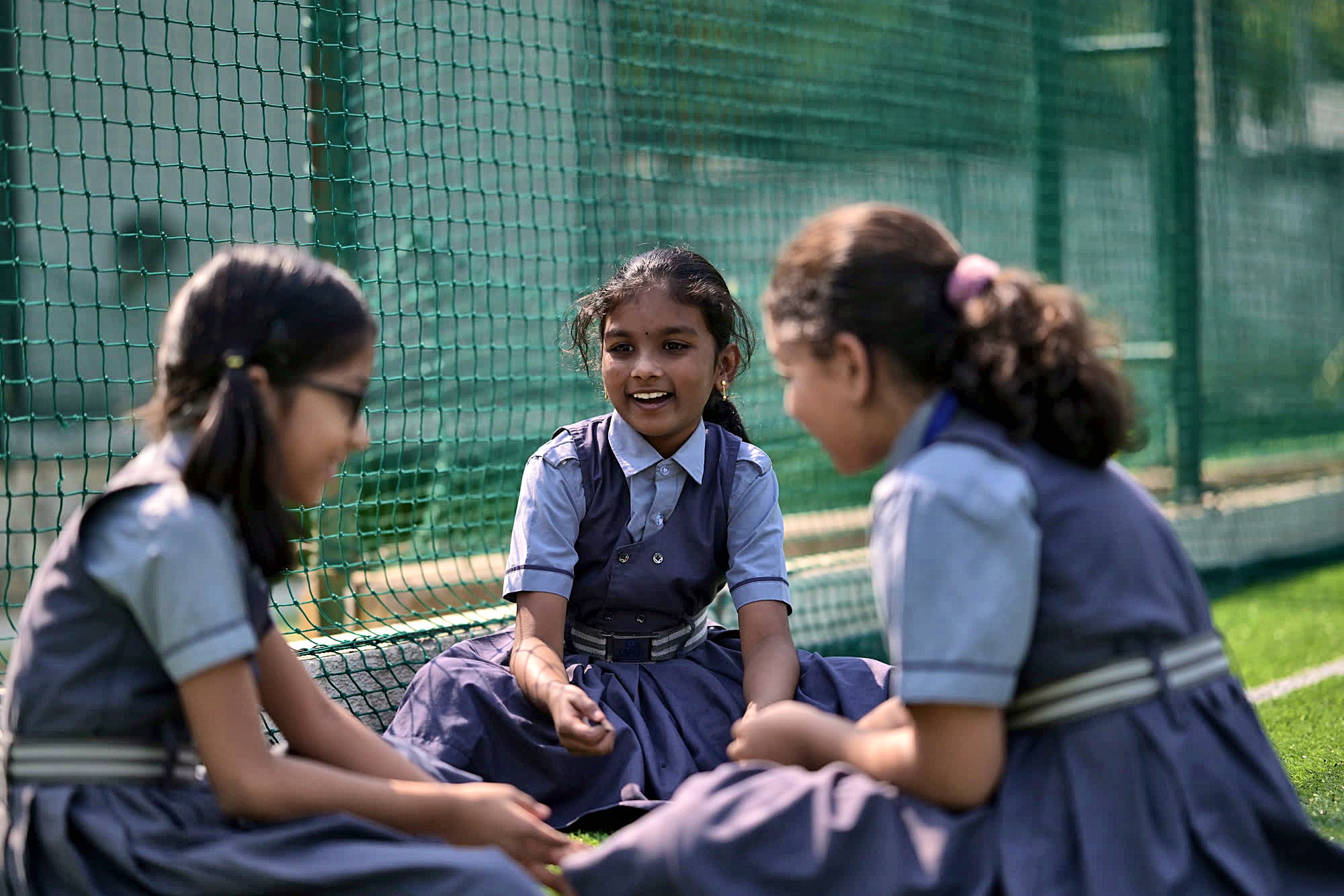 Friends chatting on the Yajur sports field