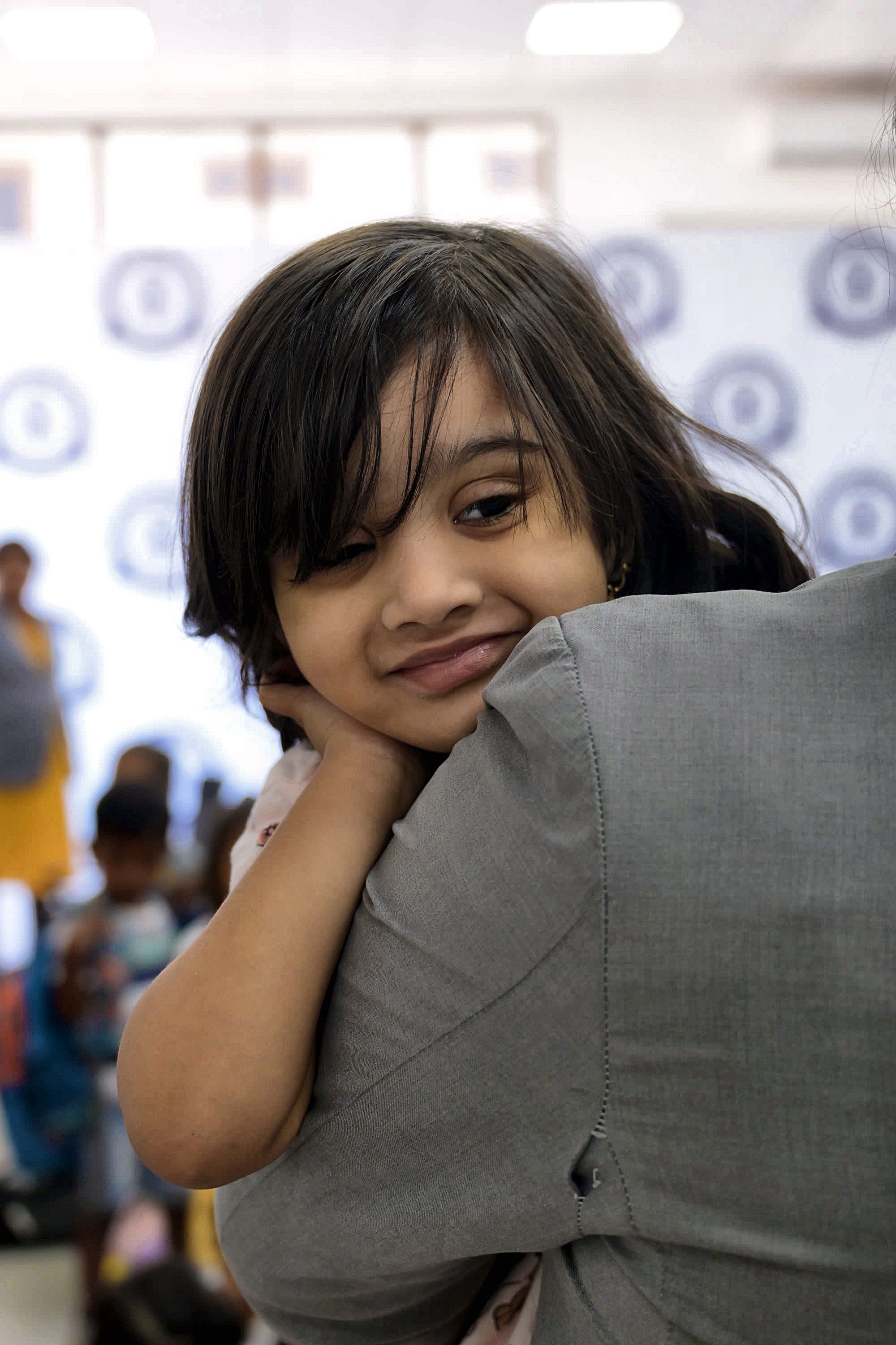A smiling Yajur student in class