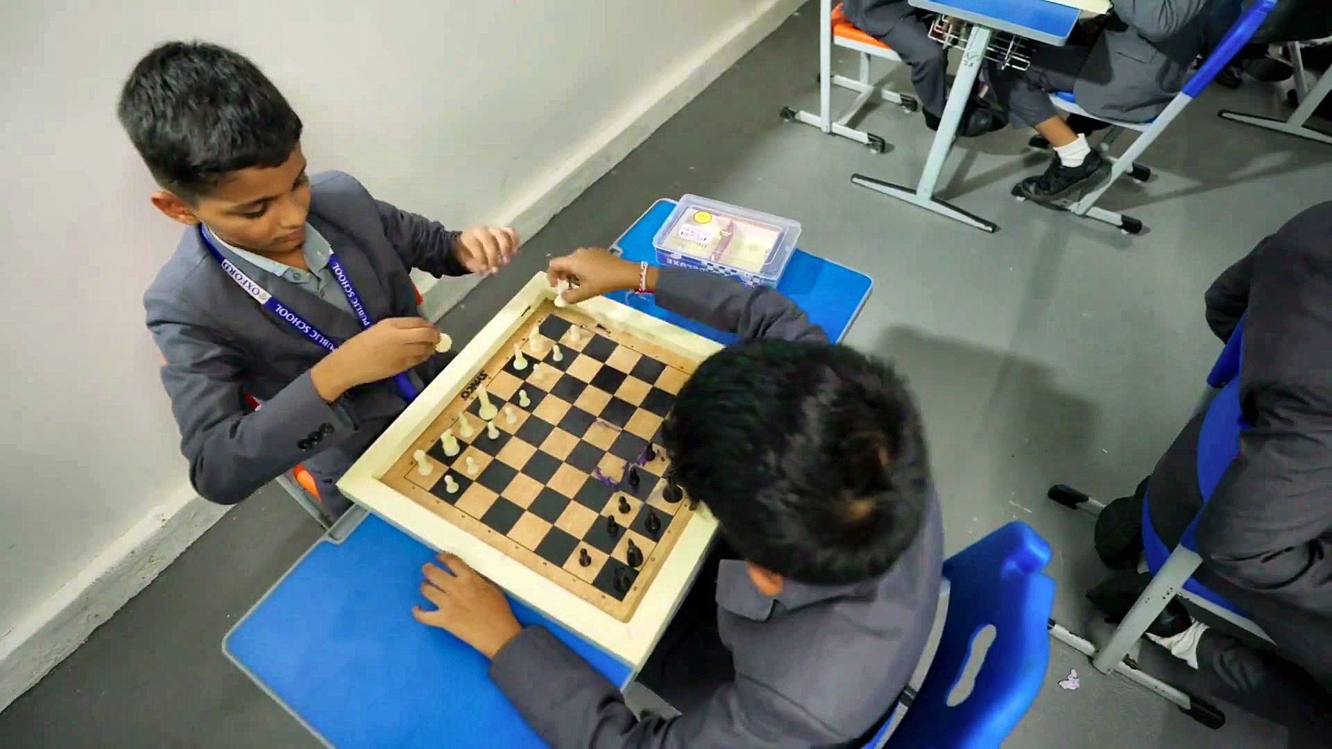 A game of chess between classmates at Yajur Public School