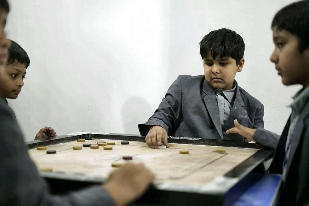 Students playing carrom at Yajur Public School